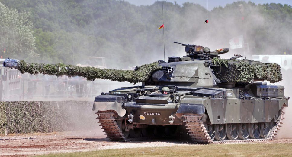 'Driving the 56t tank in Germany.  Zoom in to see the heads.  That's mine at the top.'